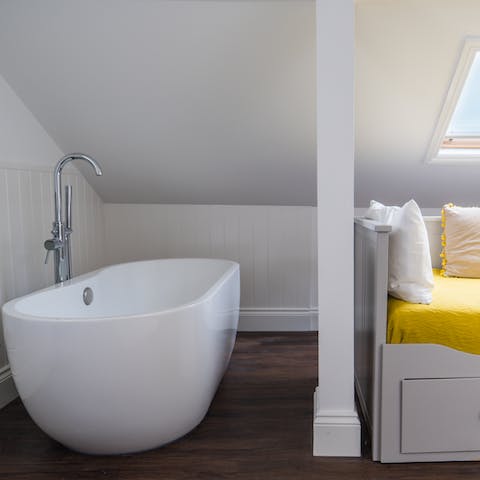 Unwind in the free standing bath after a long coastal walk, starting on the beach a two-minute walk away 
