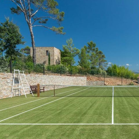 Have a tournament amongst friends on the private tennis court 
