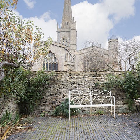 Sip your morning coffee while taking in the charming view of Burford Church 