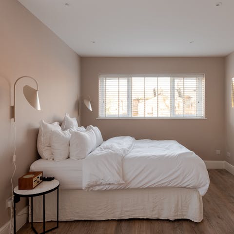 Sleep soundly in the soothing tones of the master bedroom