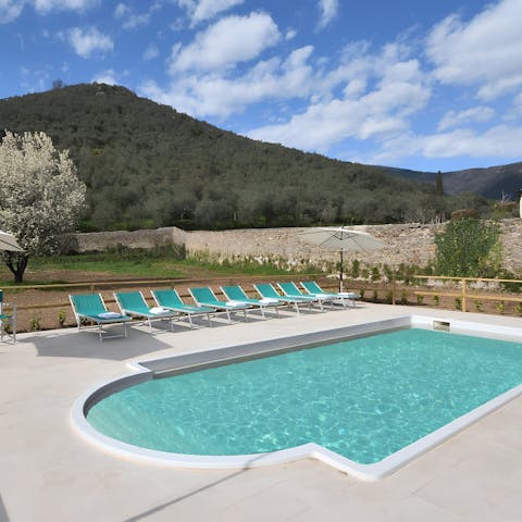Relax by the pool and take in the views of the Tuscan hills