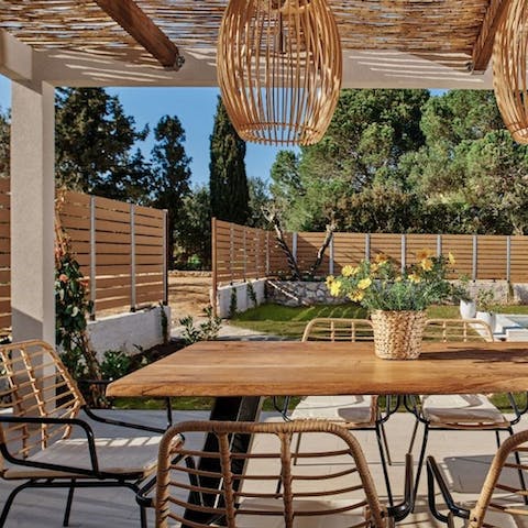 Enjoy a sun-kissed meal under the pergola on the terrace