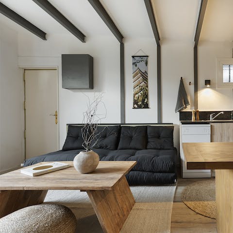 Kick back and relax in the Japanese-inspired living room, a glass of wine in hand