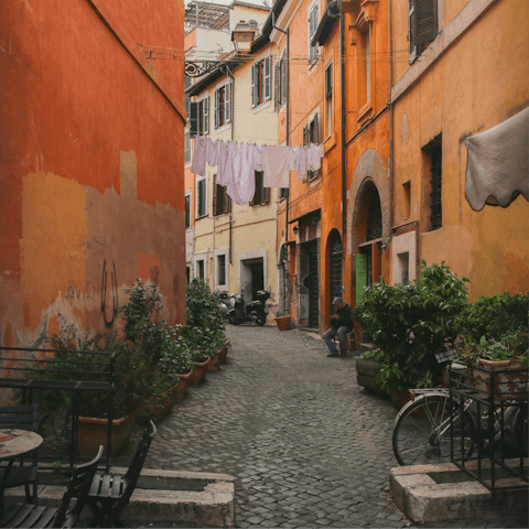 Explore the charming alleyways of postcard-worthy Trastevere