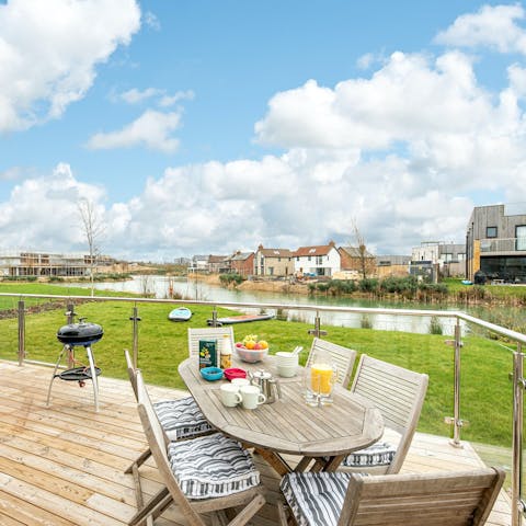 Enjoy an alfresco breakfast on the decking with views over the lake
