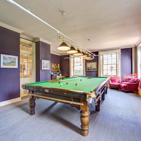 Set up a game of snooker in the billiards room