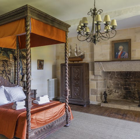 Sink into the plush bed of the master bedroom by the elegant fireplace