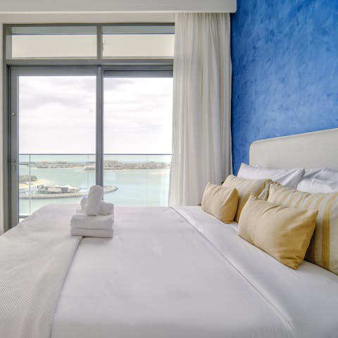 Enjoy ocean views from your bed through the floor-to-ceiling windows