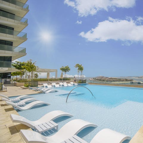 Cool off from the Dubai heat in the shared pool, located on the apartment complex