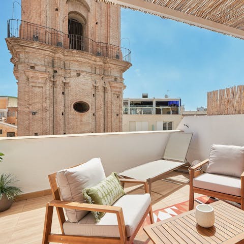 Admire the views of the Church of San Juan from the terrace