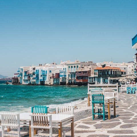 Experience the vibrant spirit of Mykonos Town – a short drive away