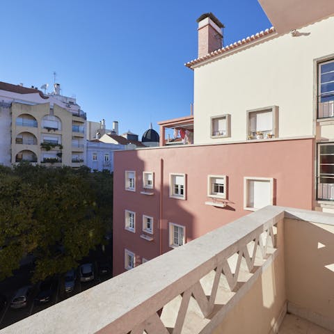 Perch on the balcony with a glass of duoro as you check out local architecture