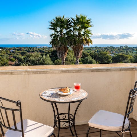 Enjoy stunning views for miles from the private balcony off the upstairs bedroom