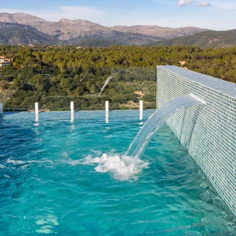 Cool off in the glistening turquoise infinity pool 