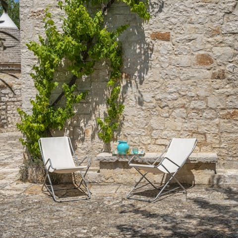 Soak up the sun in the pretty garden, surrounded by olive groves and orchards