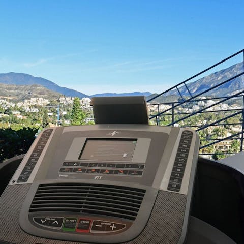 Work up a sweat in the home gym, with a breathtaking view of the mountains
