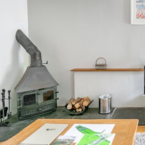 Get a fire crackling in the wood-burning stove to keep the cottage warm