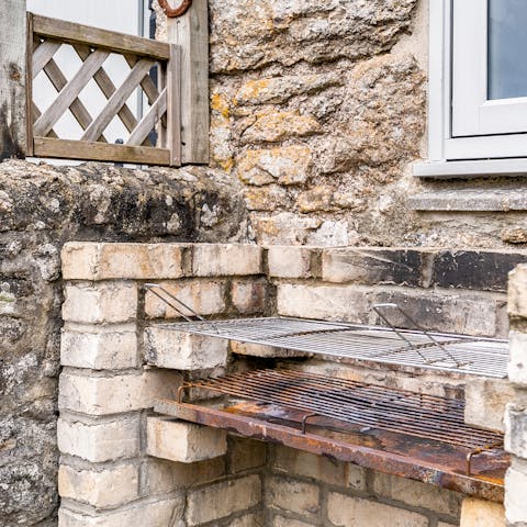 Get the built-in brick barbecue going for a feast outside