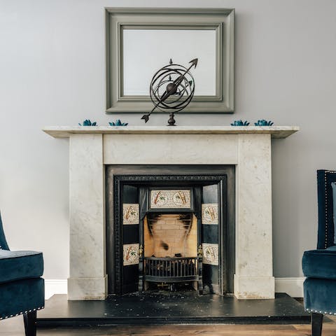 Spend cosy evenings curled up by the fireplace