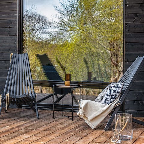 Sip a cup of coffee on the private wooded porch
