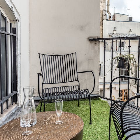 End the evening with a glass of wine on the snug balcony