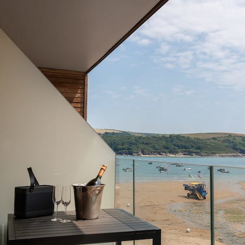 Sit out on the balcony with a glass of champers and enjoy beach views