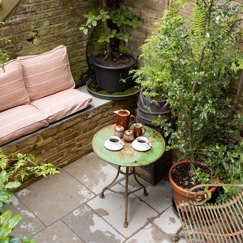 Savour your morning coffee in the secluded garden lounge