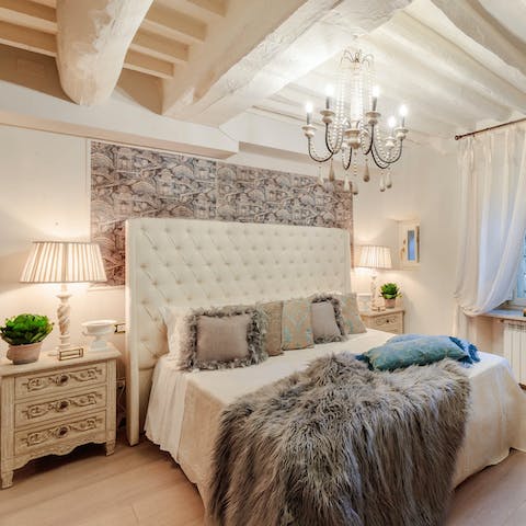 Snuggle up in the sumptuous bed after a busy day roaming around Tuscany