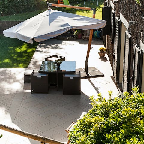 Gather around the outdoor dining table for alfresco dinners