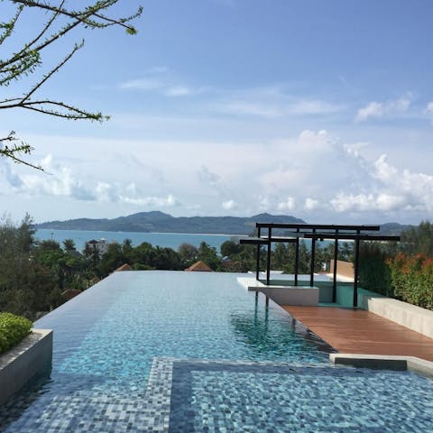 Enjoy breathtaking views of the Andaman Sea from the infinity swimming pool