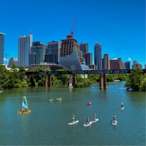 Spend the day at Lady Bird Lake, a ten-minute drive from this home