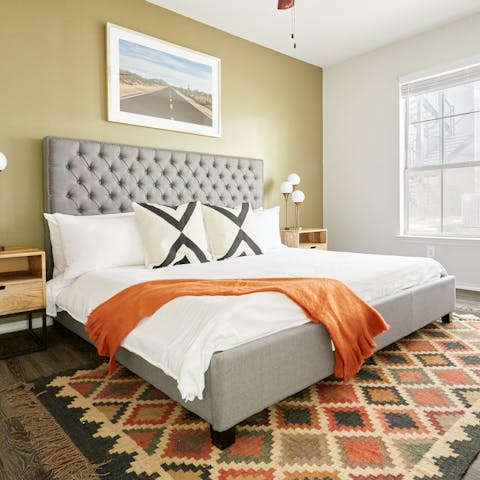 Get some rest in the stylish bedroom after a busy day exploring Austin