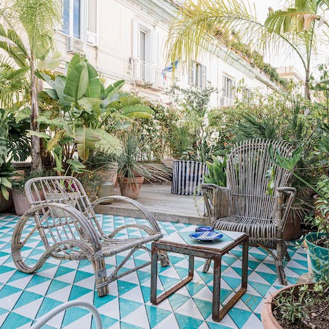 Toast to a happy holiday on the terrace, soaking up coastal views at sunset