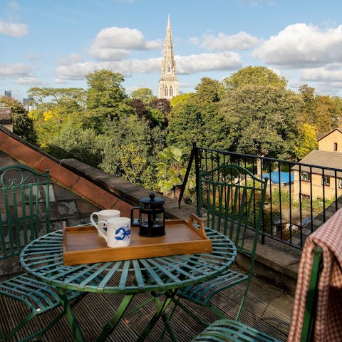 Take your coffee with a church spire view on the rooftop terrace