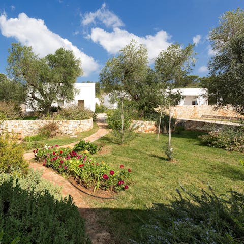 Find a peaceful spot amid the home's Mediterranean vegetation and read a few chapters of your book