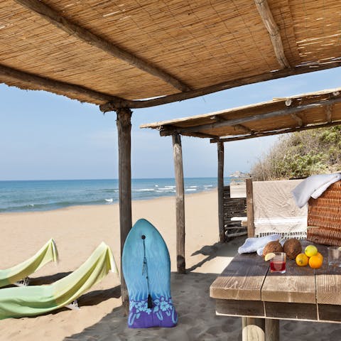 Walk just moments to the beach to your own private pergola in the sand