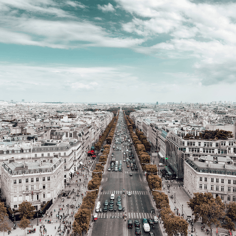 Walk down the Champs-Elysées, one of the most famous streets in the world
