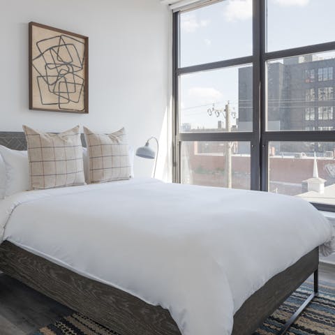 Wake up to streaming sunlight and city views