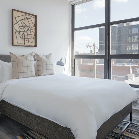Wake up to streaming sunlight and city views