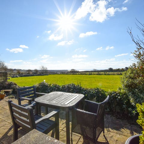 Make the most of the sunshine on the patio – you can see the sea in the distance