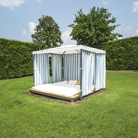 Take a break from the sun under the canopy of the day bed