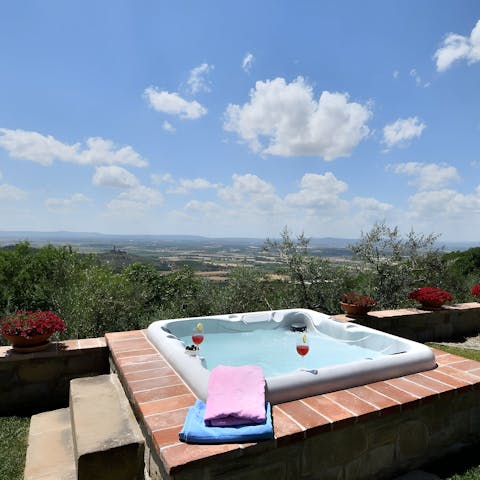 Unwind with a soak in the hot tub, admiring the panoramic views