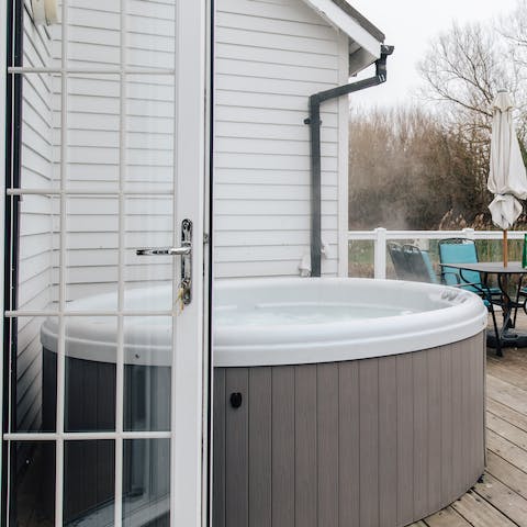 Unwind in the private hot tub on the deck