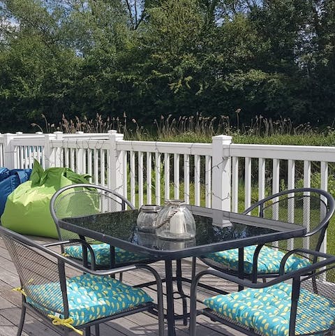 Sit outside by the water on summer evenings