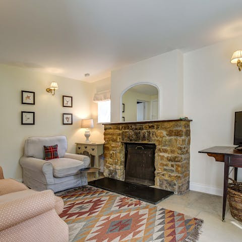 Get cosy and warm around the traditional stone fireplace