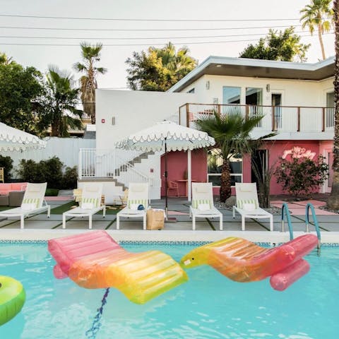 Lay back on an inflatable in the communal pool