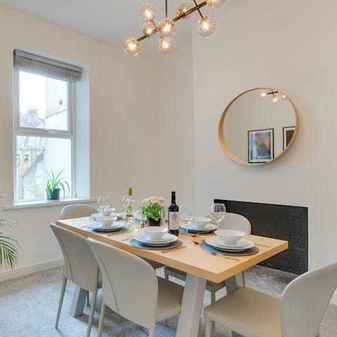 Enjoy relaxed dinners, drinks, and card games at home in the bright dining room