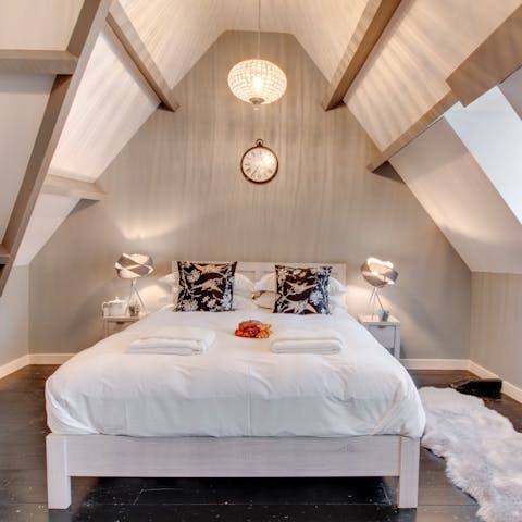 Sleep soundly beneath the beautiful vaulted ceiling in the attic room