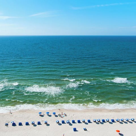 Stroll down to Perdido Beach and sprawl out in the sand