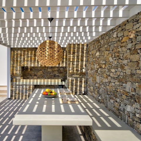 Share memorable meals together under the sun-dappled pergola